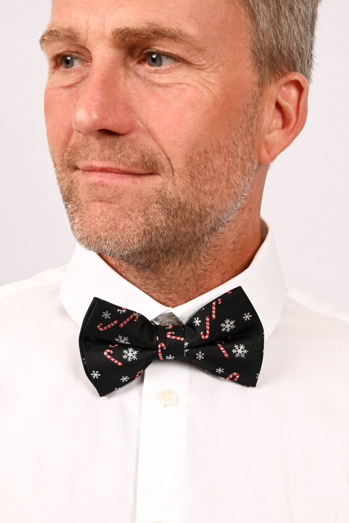 Fliege Schwarz mit Zuckerstangen und Schneeflocken