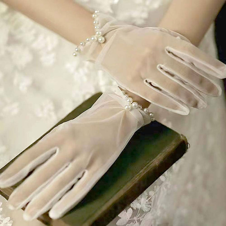 Kurze transparente Handschuhe mit Perlenrand ivory