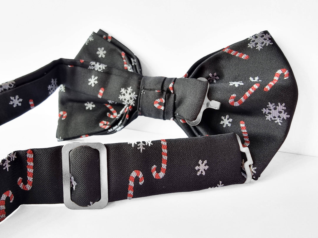 Fliege Schwarz mit Zuckerstangen und Schneeflocken