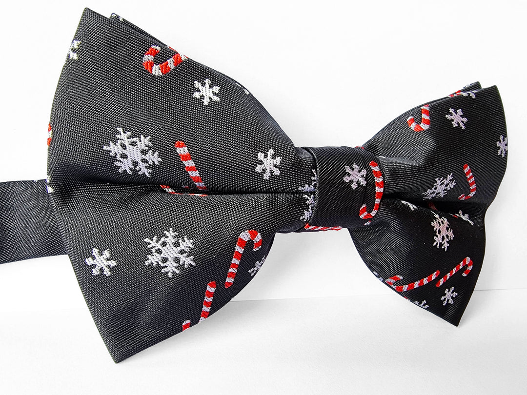 Fliege Schwarz mit Zuckerstangen und Schneeflocken