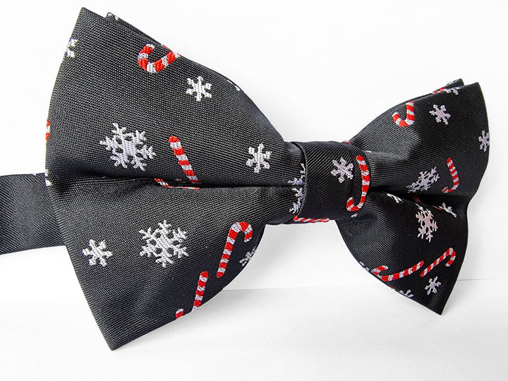 Fliege Schwarz mit Zuckerstangen und Schneeflocken