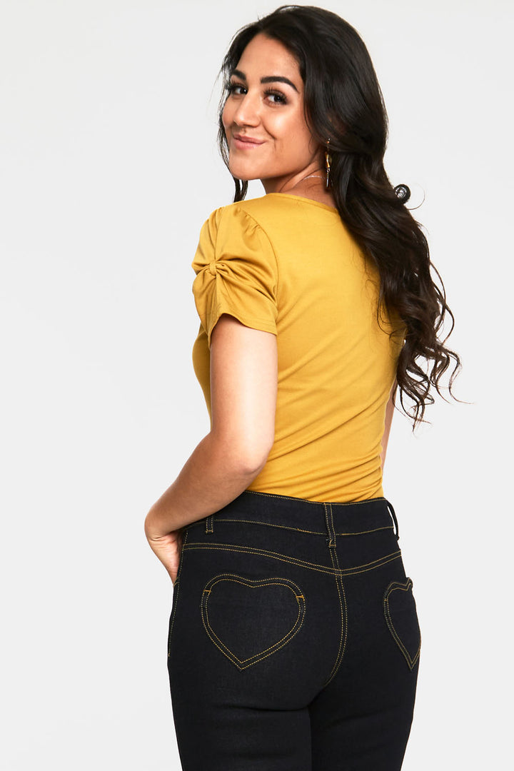 Voodoo Vixen – Rhiannon Mustard Bow V-neck Top